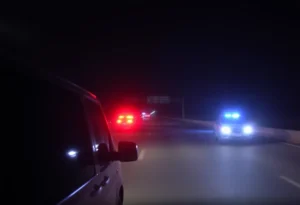 Scene of a police chase at night with police lights